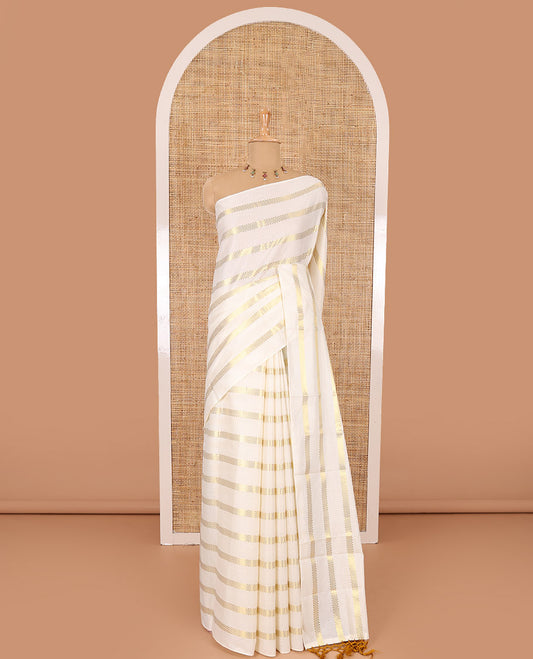 Borderless cream and mustard horizontal muthu zari striped Kerala cotton saree, self-pallu with tassels, and a matching blouse