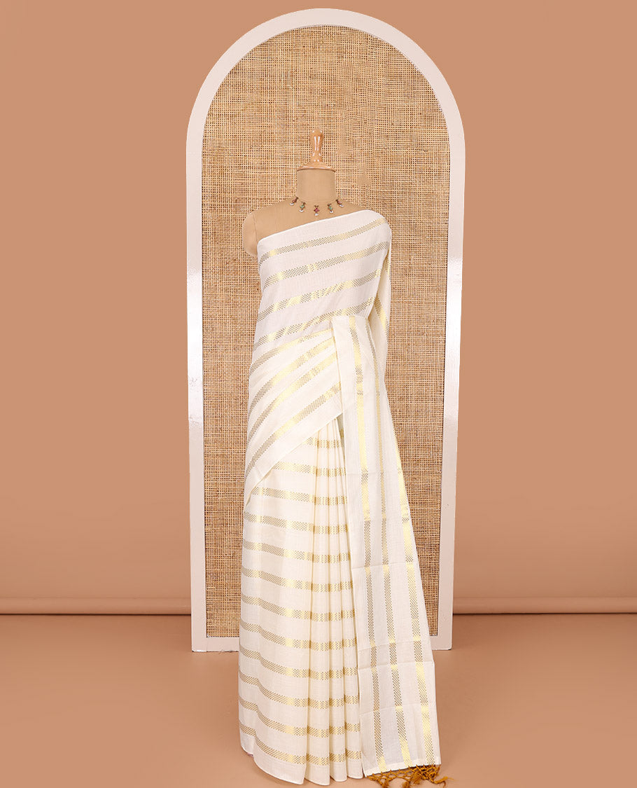 Borderless cream and mustard horizontal muthu zari striped Kerala cotton saree, self-pallu with tassels, and a matching blouse