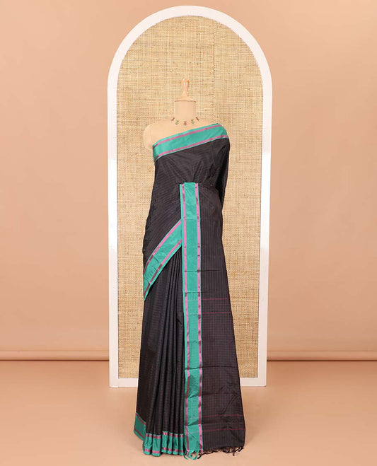 Black horizontal striped semi-soft silk saree, contrast satin striped border, striped pallu, and a matching blouse