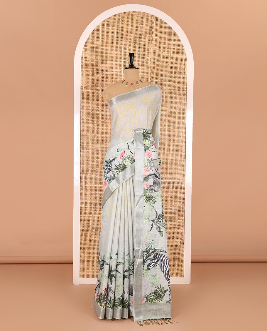 Grey wild-life theme printed Linen cotton saree, bavanji border, pallu of elephant, zebra, and flamingo designs, and coconut tree motifs printed blouse