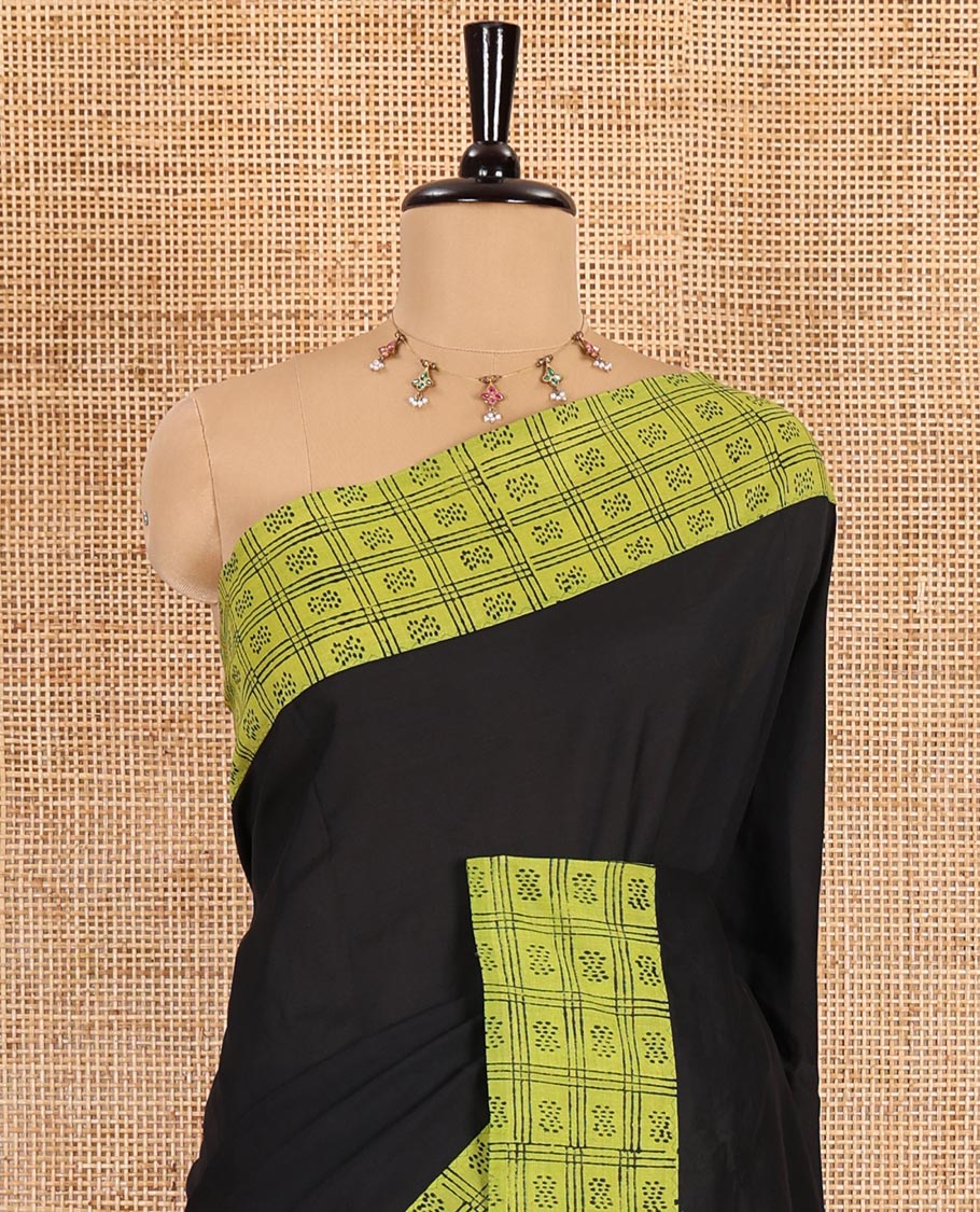 Black plain South cotton saree, contrast block printed border, and pallu of butta enclosed checks print, and block printed blouse