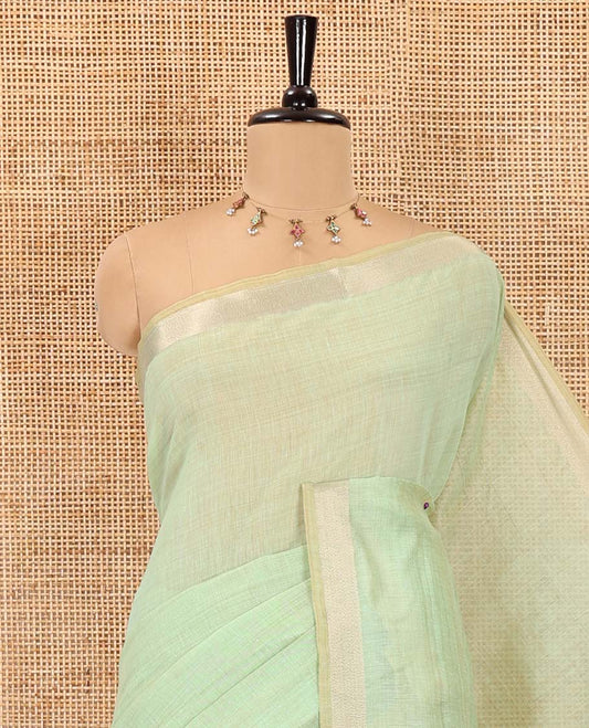 Green plain Munga cotton saree, gold zari piping boder, contrast pallu of multi-color jamdani weave, and contrast zari buttas blouse