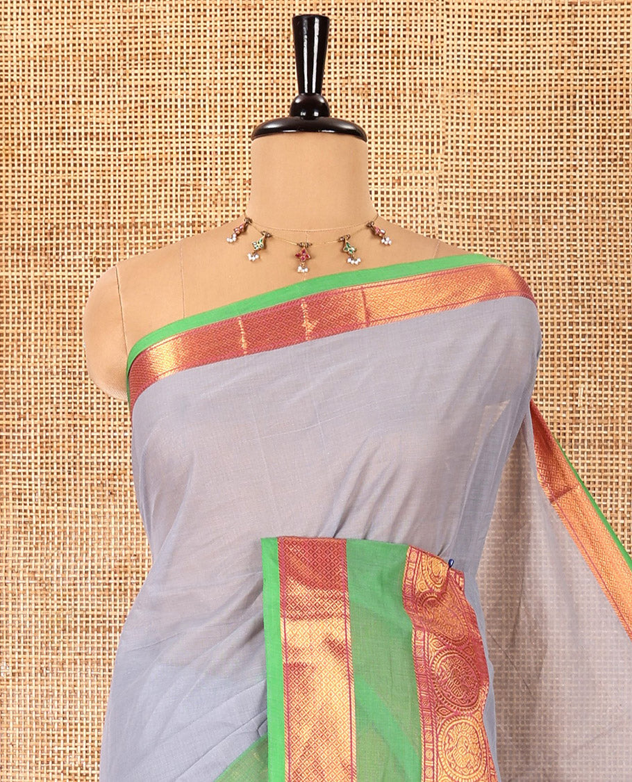 Silver grey plain Chettinad cotton saree, contrast traditional zari rettai pettu border, striped pallu, and a matching blouse