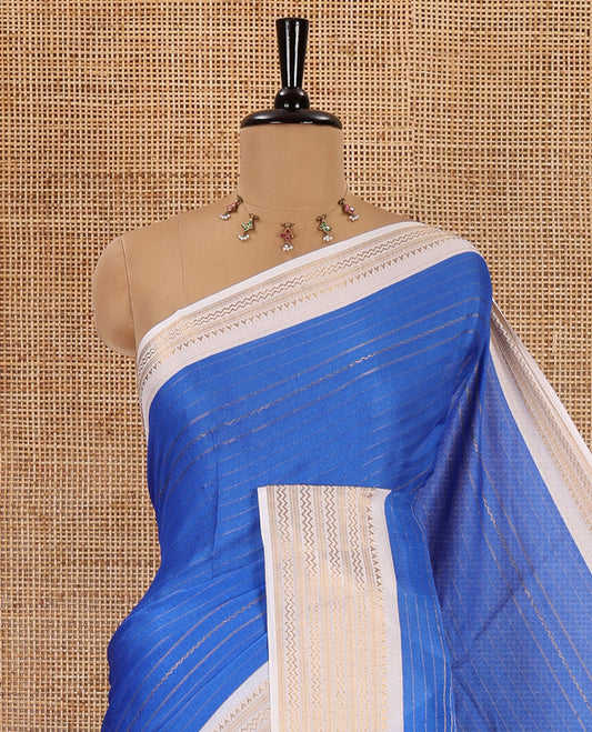 Blue horizontal striped moss chiffon saree, contrast traditional zari border, geometric patterns printed pallu, and a printed blouse