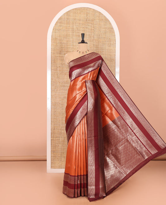 Rust orange zari checked kanchi silk saree, contrast traditional rettai pettu border of chakram motifs, jaal pallu, and a zari design pallu