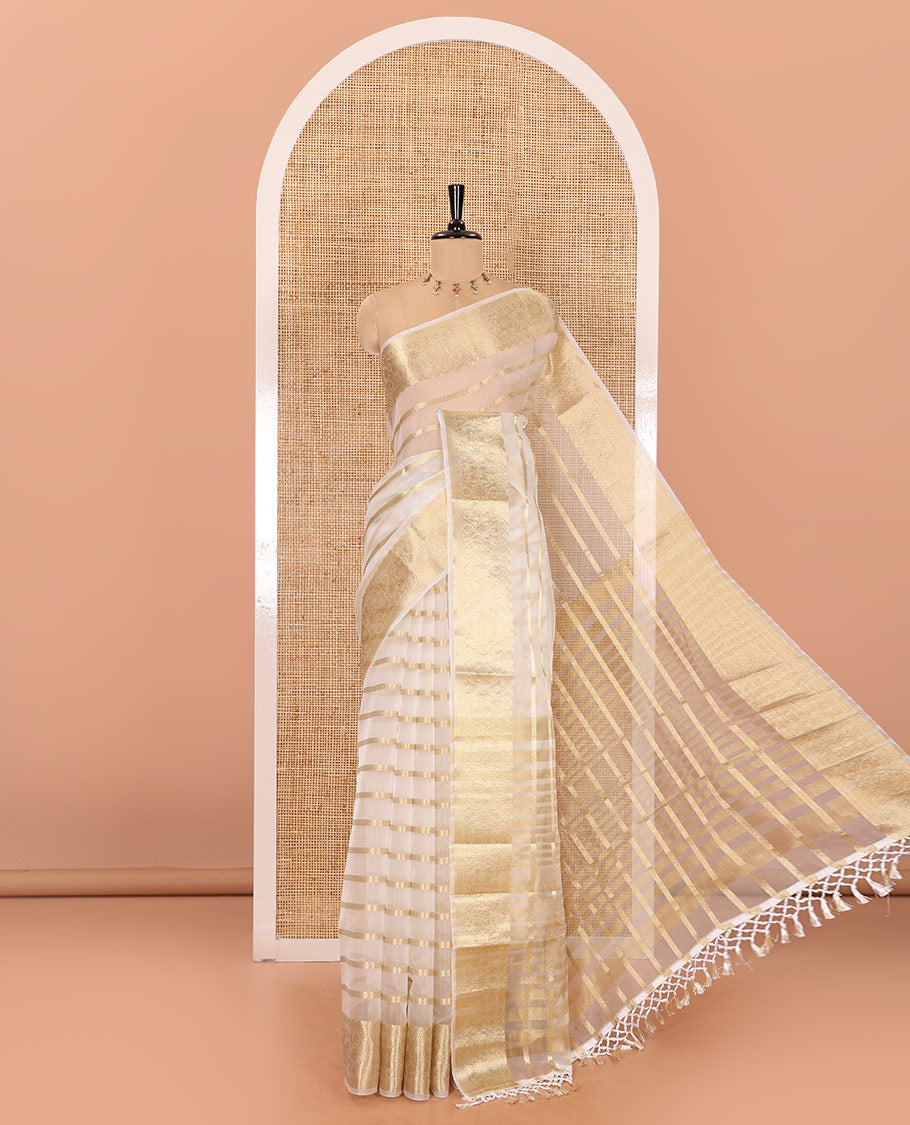 Half-white zari leaf vine design semi-organza saree, traditional zari design border, zari striped pallu, and a matching blouse