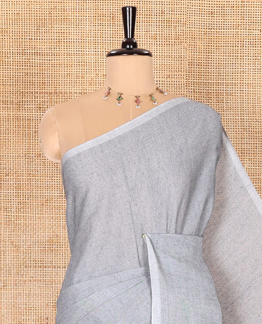 Borderless Sliver Grey Plain Khadi Mul Cotton Saree Features a Self-Pallu with Tassels, and a Matching Blouse