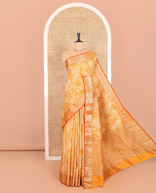 Mustard Semi-Tussar Saree Meticulously Crafted with Floral-Enclosed Diamond Patterns Printed Across the Body, Featuring a Subtly Woven Border with Traditional Zari Designs, and a Pallu Elevated with Zari Stripes, Paired with a Matching Blouse