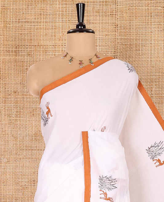 Cream South Cotton Saree Adorned with Deer Motifs Printed All Over Its Body, Complemented by a Contrast Plain Border, and Paired with a Contrast Floral Printed Blouse