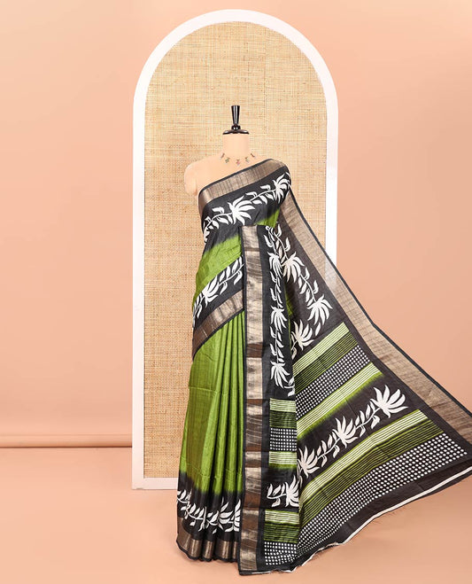Green Plain Dola Silk Saree Decked Up with Contrast Border of Leaf Vines Print and Zari Work, Pallu of Floral and Geometric Print, and Paired with a Contrast Blouse