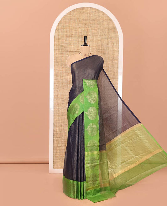 Navy Blue Tissue-Cotton Blended Saree, Subtly Sparkled with Vertical Stripes on Its Body, Complemented by Contrast Border of Tree Motifs Woven, a Pallu Steeped with Zari Stripes, and Paired with a Contrast Blouse