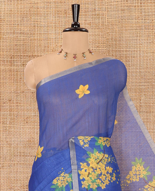 Blue Linen Saree, Beautified with Averrhoa Carambola-Style Floral Motifs Print, Subtle Piping Border, Pallu Mirrors the Same Print, and Paired with a Matching Blouse