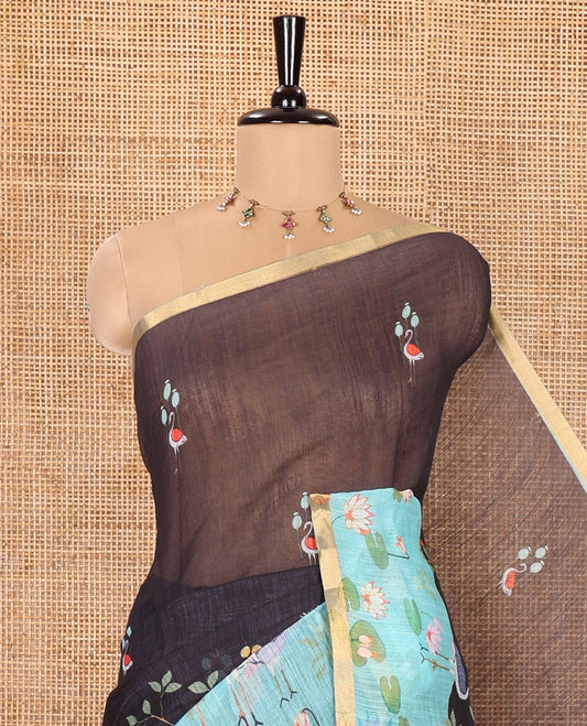 Black Linen Cotton Saree, Prettified with Crane and Floral Printed on Its Body, Subtle Piping Border, Captivating Contrast Pallu of Floral, Pichwai Lotus and Bird Designs, and Paired with a Contrast Blouse