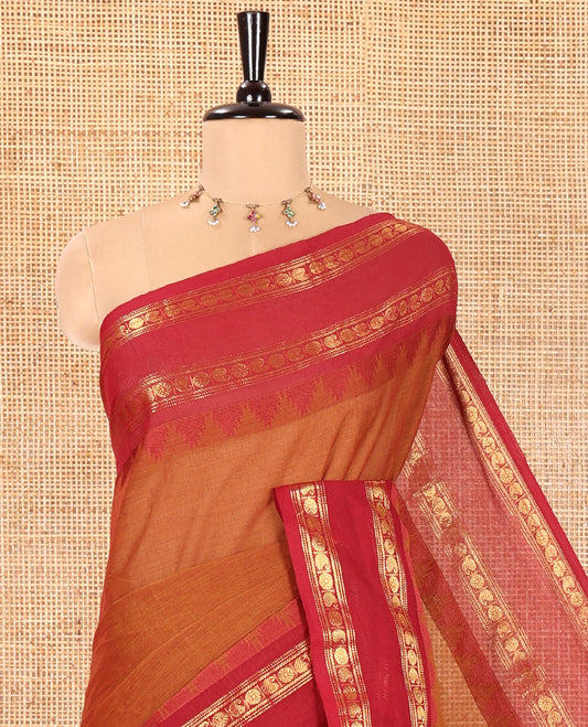Honey Color Chettinad Cotton Saree, Adorned with Thread Buttas All Over Its Body, Complemented by a Contrast Temple Rettai Pettu Traditional Zari Design Border, Pallu of Stripes and Buttas, and Paired with a Matching Blouse