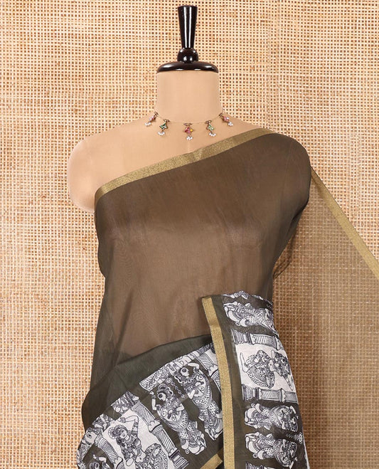 Green Chanderi Cotton Saree, Highlighted with Kalamkari-Style Ancient Human Figurines Printed on Its Body, Subtle Zari Piping Border, Pallu Depicting Kalamkari Peacocks, and Paired with a Matching Blouse