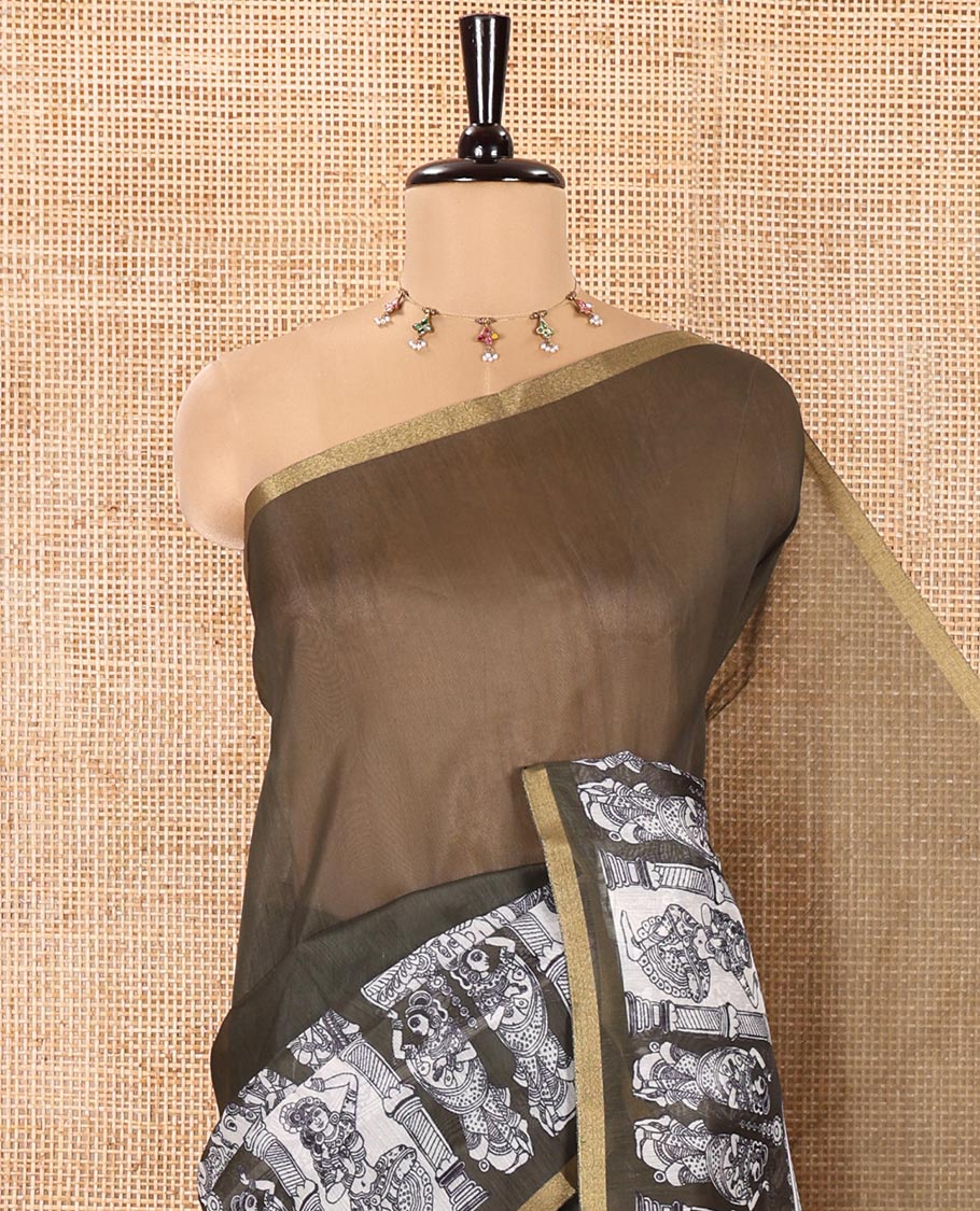 Green Chanderi Cotton Saree, Highlighted with Kalamkari-Style Ancient Human Figurines Printed on Its Body, Subtle Zari Piping Border, Pallu Depicting Kalamkari Peacocks, and Paired with a Matching Blouse