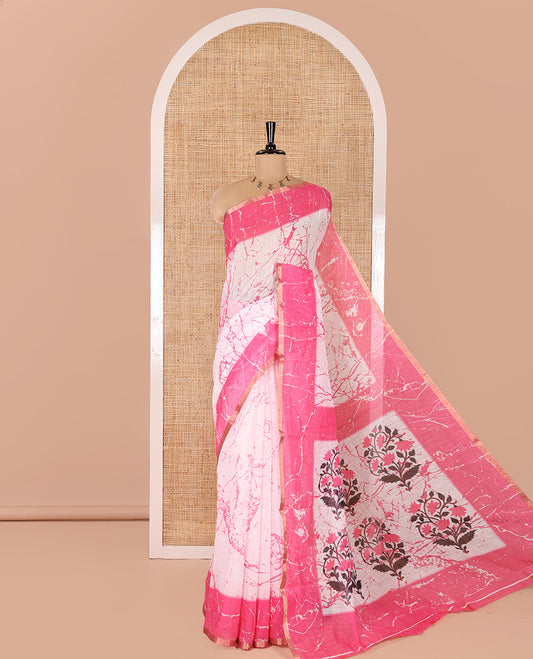 Cream and Pink Linen Cotton Saree, Decorated with Batik Print on Its Body, Complemented by Contrast Batik Printed Border, Pallu of Floral Print, and Paired with a Contrast Blouse