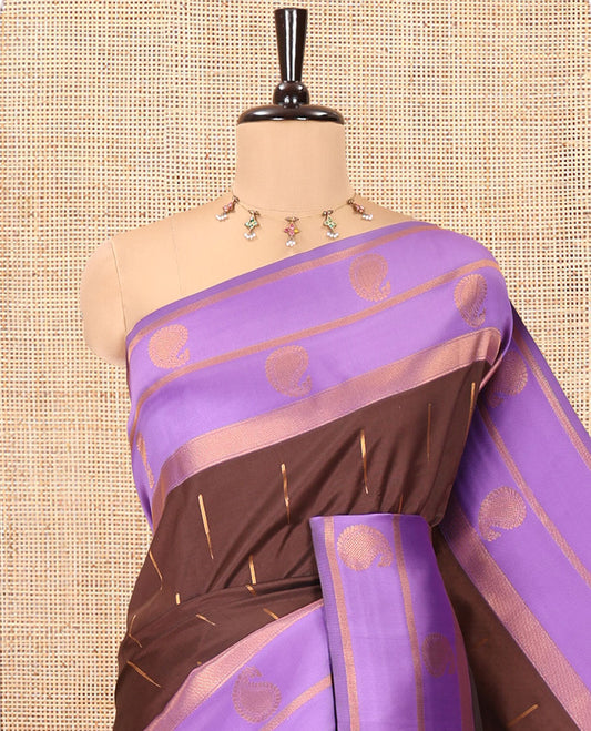Brown and Lavender Kanchi Silk Saree, Adorned with Zari Buttas All Over Its Body, Complemented by a Contrast Border of Paisleys, Zari-Striped Pallu, and Paired with a Contrast Jacquard Blouse