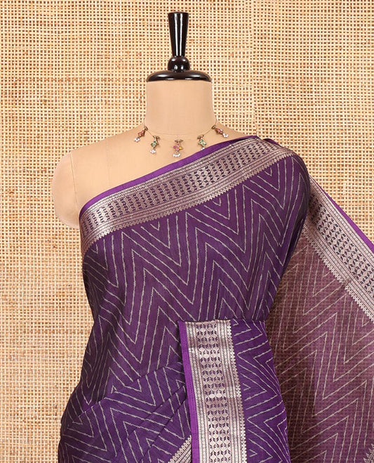 Violet Dola Silk Saree, Subtly Sparkled with Chevron Stripes on Its Body, Highlighted by Traditional Zari Design Border, Intricately Designed Pallu, and Paired with a Matching Blouse