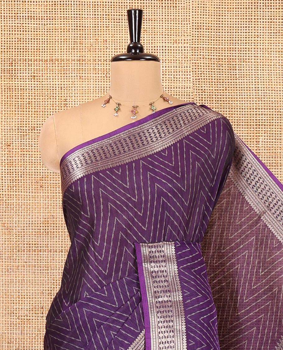Violet Dola Silk Saree, Subtly Sparkled with Chevron Stripes on Its Body, Highlighted by Traditional Zari Design Border, Intricately Designed Pallu, and Paired with a Matching Blouse
