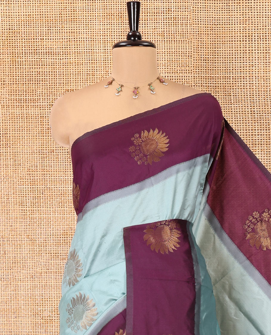 Dusky Pastel Green Kanchi Silk Saree, Elegantly Highlighted with Floral Zari Buttas All Over Its Body, Complemented by Contrast Floral Design Border, Intricately Designed Pallu, and Paired with a Contrast Blouse
