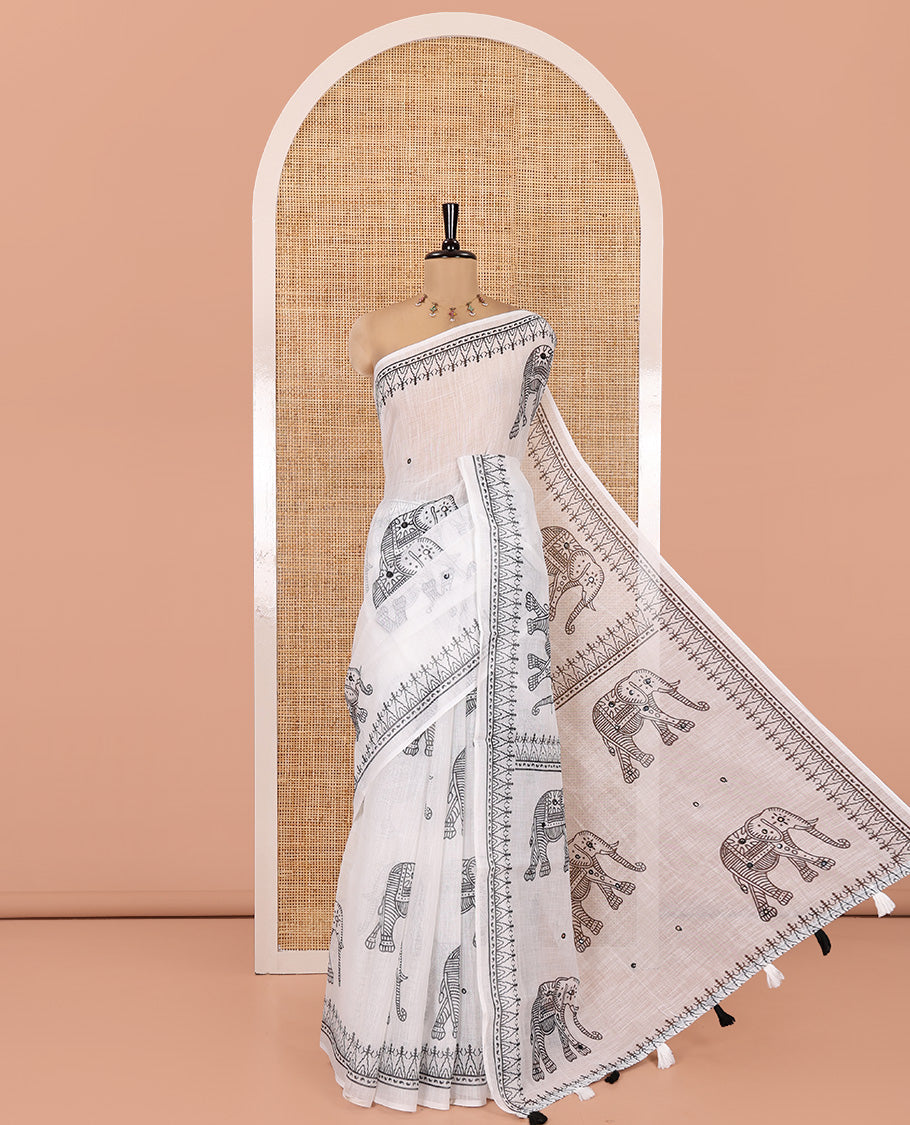 White Linen Cotton Saree Features Elephant Print and Mirrorwork, a Temple Border, a Self-Pallu, and a Contrast Blouse