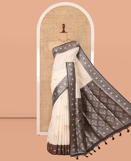 Cream-Black Elite Soft Silk Saree, Accentuated with Zari Buttas, a Contrast Floral Creeper Border, Intricate Pallu, and a Contrast Blouse