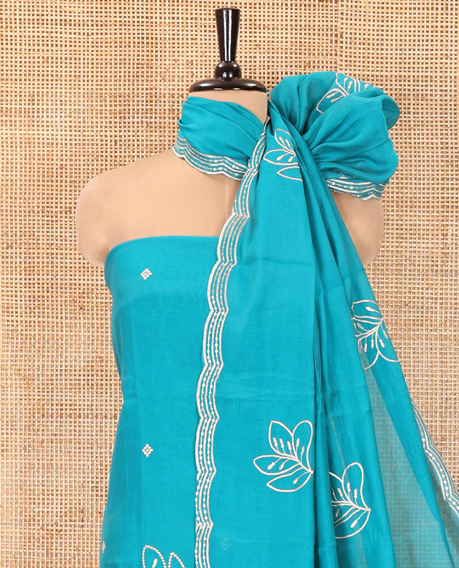 Blue Mul Chanderi Designer Material Chudidar Set, Meticulously Woven with Big Floral Motifs Embroidered On Its Top, A Plain Santoon Bottom, and Paired with a Mul Chanderi Scallop Thread Embroidered Dupatta