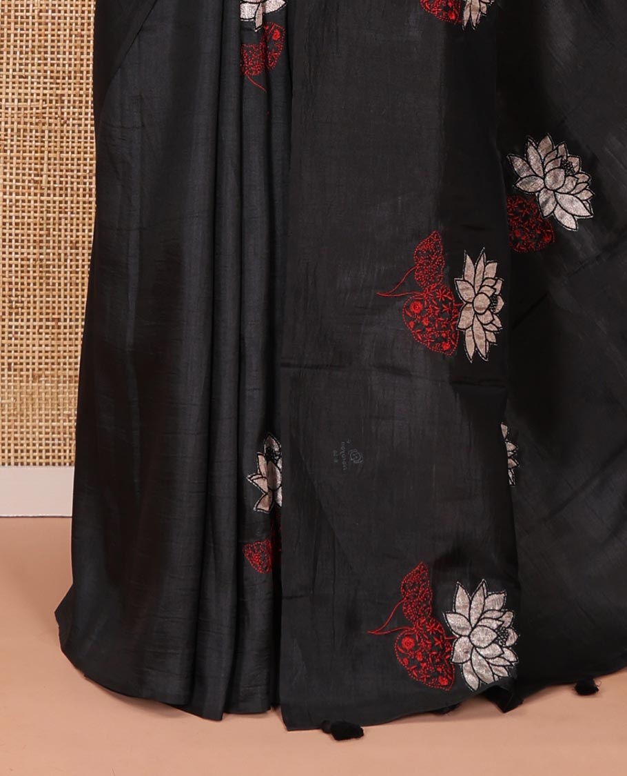 Borderless black floral motifs embroidered fancy tussar saree, floral motifs embroidered pallu, and a plain blouse