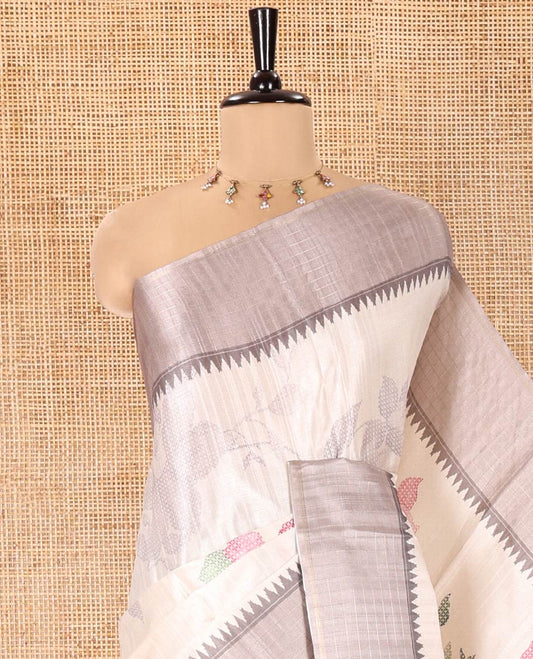 Off-White Fancy Tussar Silk Saree, Enthralled with Floral Cross Stitch Embroidery All Over Its Body, Complemented by a Contrast Temple Zari Checked Border, Pallu of Checked Designs, and Paired with a Contrast Blouse