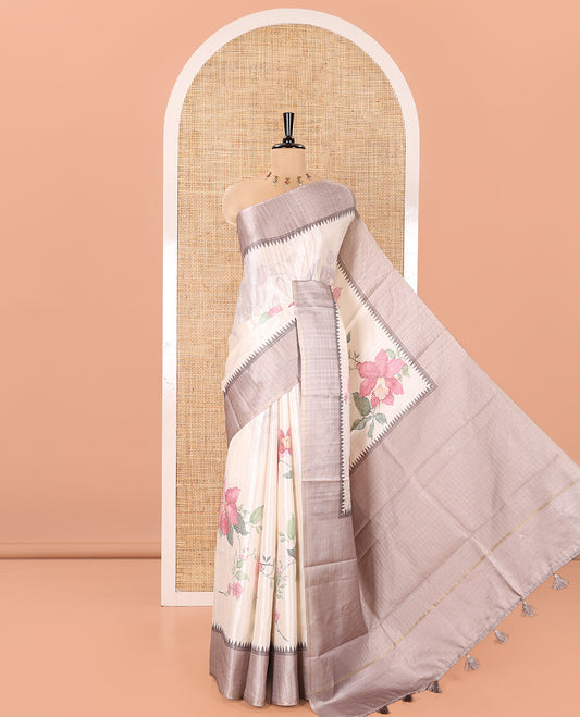 Off-White Fancy Tussar Silk Saree, Enthralled with Floral Cross Stitch Embroidery All Over Its Body, Complemented by a Contrast Temple Zari Checked Border, Pallu of Checked Designs, and Paired with a Contrast Blouse