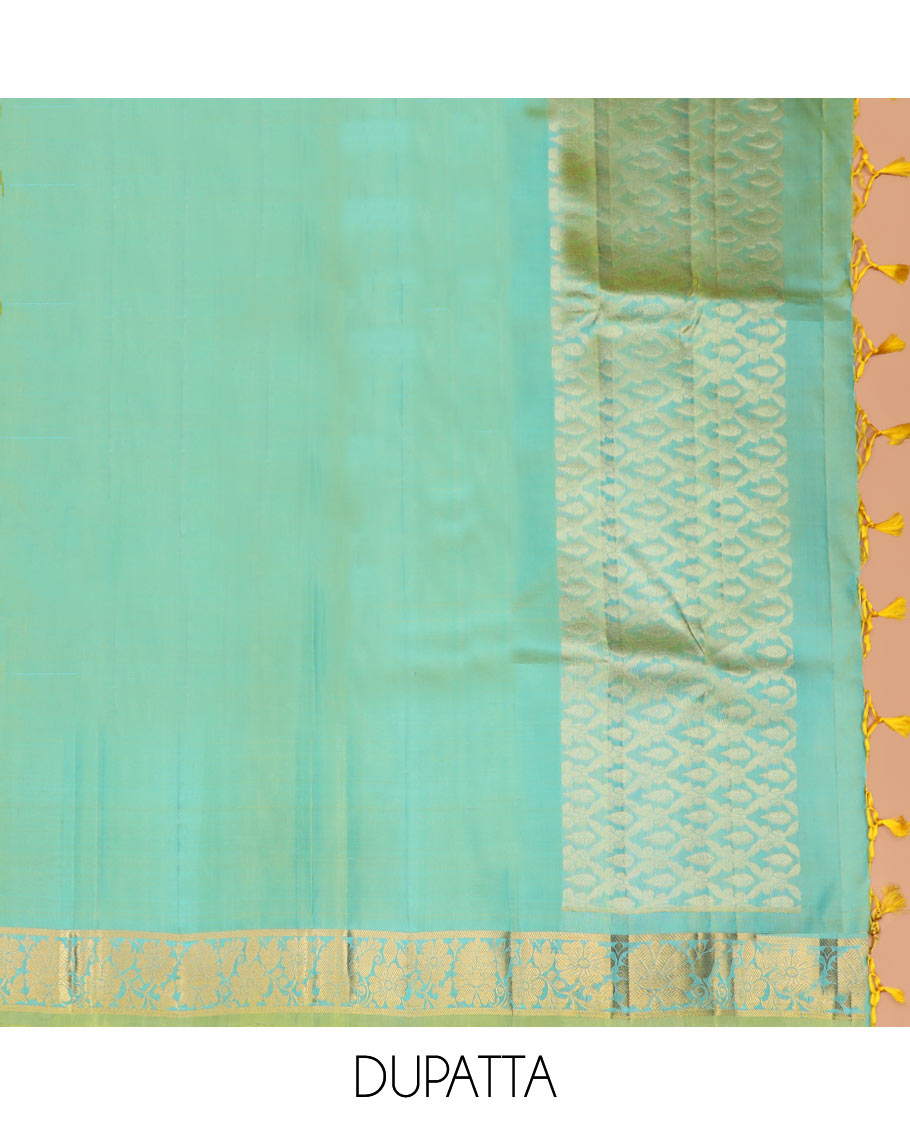 Blue Pure Silk Half-Saree Adorned with Zari Buttas Enclosed in Checks on the Skirt, Complemented by a Contrast Border Featuring Thilakam Mokku, Arumbu Manga, and Mayil Kann Designs, Paired with a Contrast Blouse, and a Jaal Design Dhavani