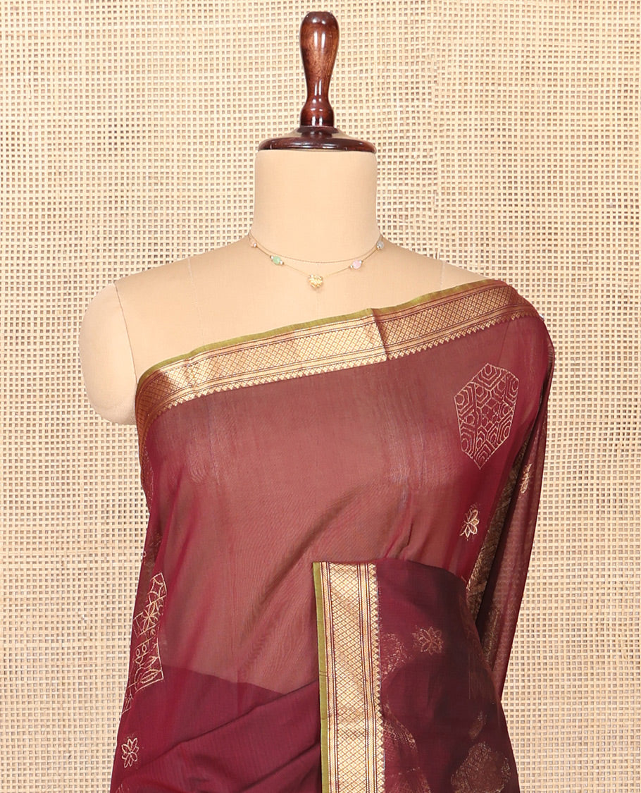 Brown Silk Cotton Saree, Embellished with Zari Buttas All Over Its Body, Complemented by Contrast Traditional Zari Designs Woven Border, Intricately Designed Pallu and Paired with a Contrast Blouse