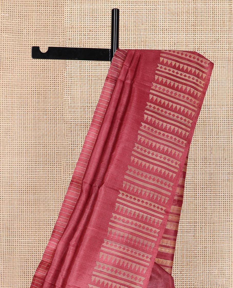Red plain tussar silk saree, self border and pallu features geometric patterns, and temple motifs