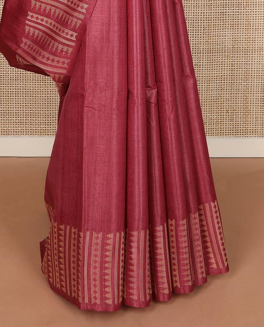 Red plain tussar silk saree, self border and pallu features geometric patterns, and temple motifs