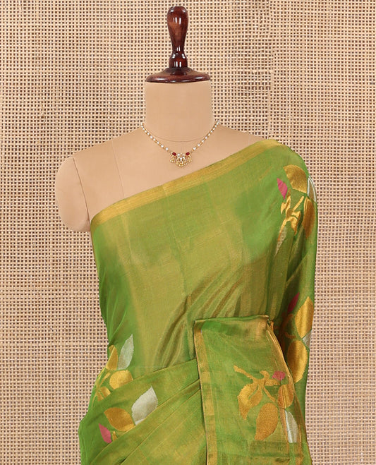Borderless parrot green Uppada Silk Saree Artfully Detailed with Leaf Zari Buttas, Complemented by Contrast Pallu Steeped with Leaf Zari Designs, and Paired with a Contrast Blouse