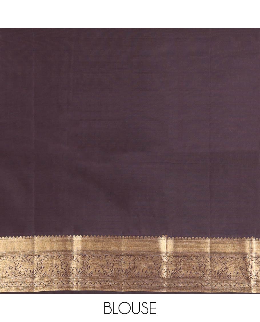 Brown Vasundhara Lite-Silk Mix Saree, Delicately Woven with Zari Buttas on Its Body, Highlighted by a Zari Border of Mayil Kann, Muthu, Yaanai, Kuthirai, and Lavangam Designs, Gracefully Embellished Pallu, and Paired with a Matching Blouse