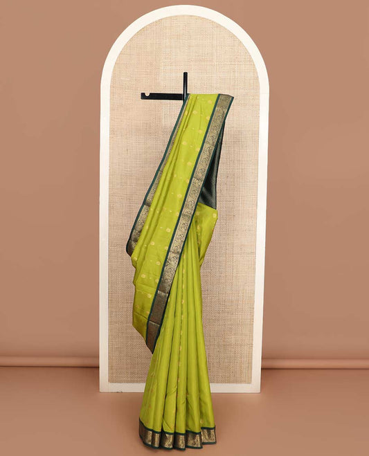 Green zari buttas Vasundhara silk mix saree, contrast border of muthu, poun, and mayil designs, and intricate pallu