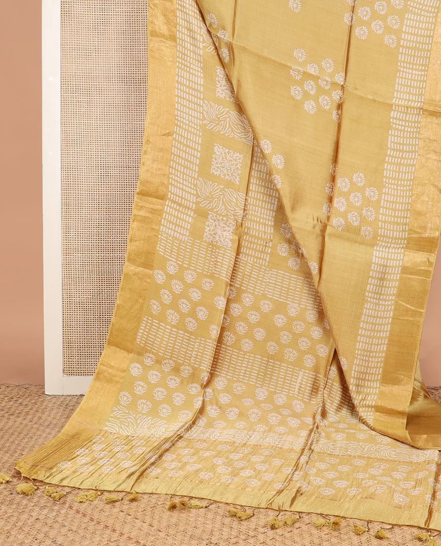 Yellow floral and geometric printed banana pith saree, zari border, and printed pallu
