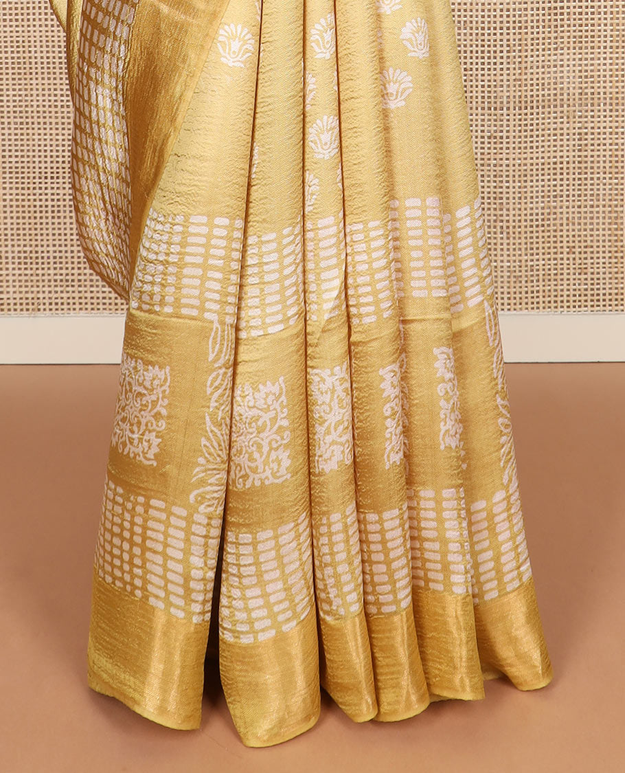 Yellow floral and geometric printed banana pith saree, zari border, and printed pallu