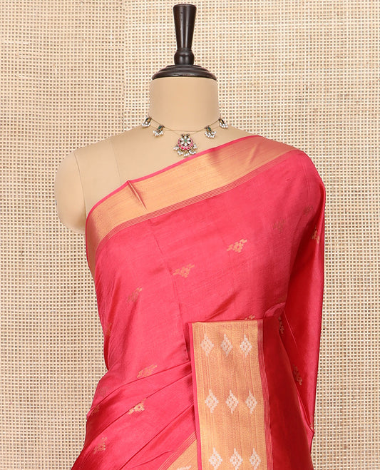 Red Banana Pith Saree Elegantly Framed with Zari Buttas, Artfully Detailed Border with Zari Designs, Gleaming Zari Stripes Woven Pallu, and Paired with a Matching Plain Blouse
