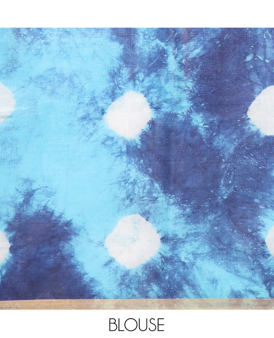 Blue Banana Pith Saree Enthralled  with Shibori Prints, Zari Bavanji Border, Complemented with a Shibori Printed Pallu, and Paired with a Matching Shibori Printed Blouse