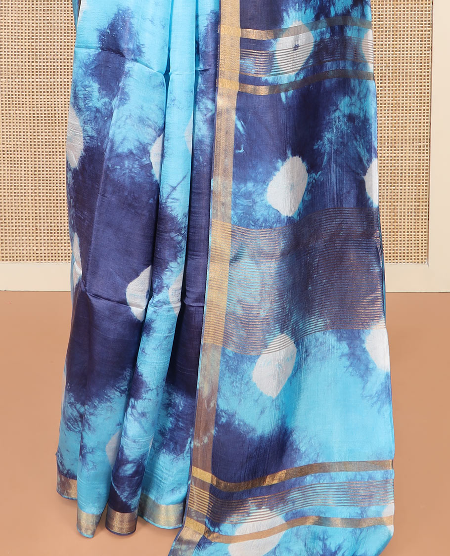 Blue Banana Pith Saree Enthralled  with Shibori Prints, Zari Bavanji Border, Complemented with a Shibori Printed Pallu, and Paired with a Matching Shibori Printed Blouse