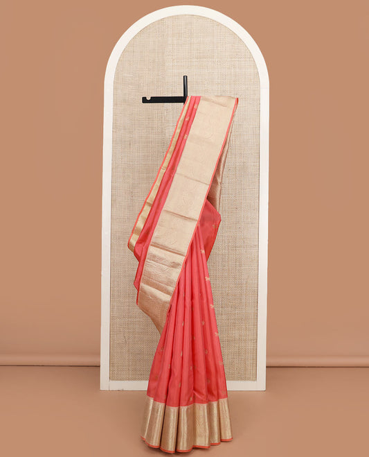 Peach zari buttas silk saree, contrast border of thilakam mokku, muthu, rudraksham, mayil kann, and manga designs, and jaal pallu