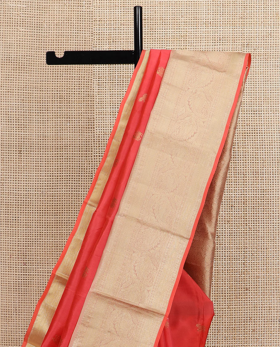 Peach zari buttas silk saree, contrast border of thilakam mokku, muthu, rudraksham, mayil kann, and manga designs, and jaal pallu