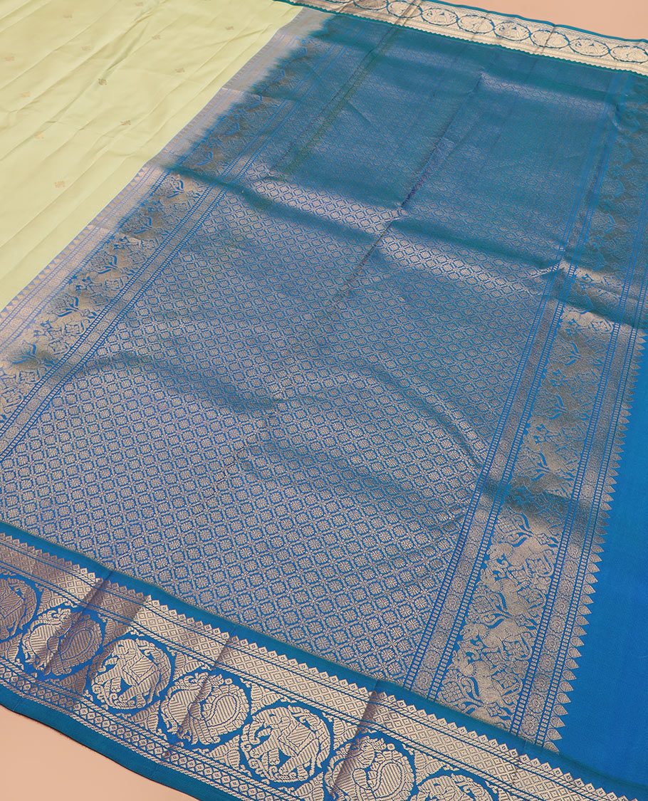 Green zari buttas silk saree, contrast border of banaras, mayil kann, round mayil, and round yaanai designs, and jaal pallu