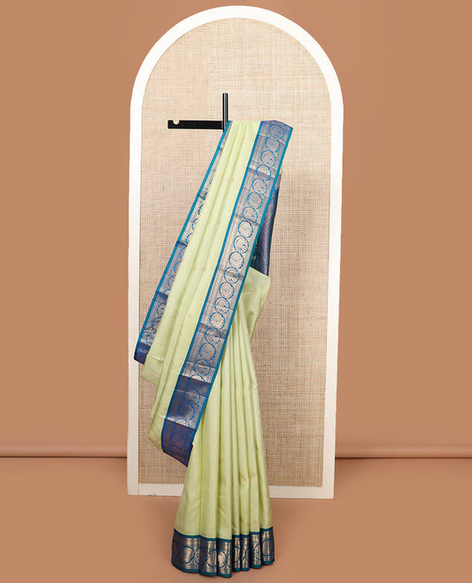 Green zari buttas silk saree, contrast border of banaras, mayil kann, round mayil, and round yaanai designs, and jaal pallu