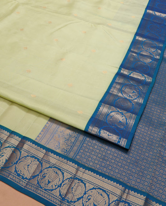 Green zari buttas silk saree, contrast border of banaras, mayil kann, round mayil, and round yaanai designs, and jaal pallu