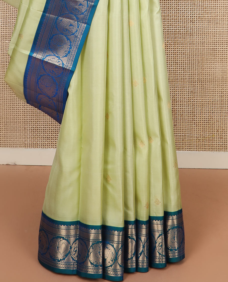 Green zari buttas silk saree, contrast border of banaras, mayil kann, round mayil, and round yaanai designs, and jaal pallu