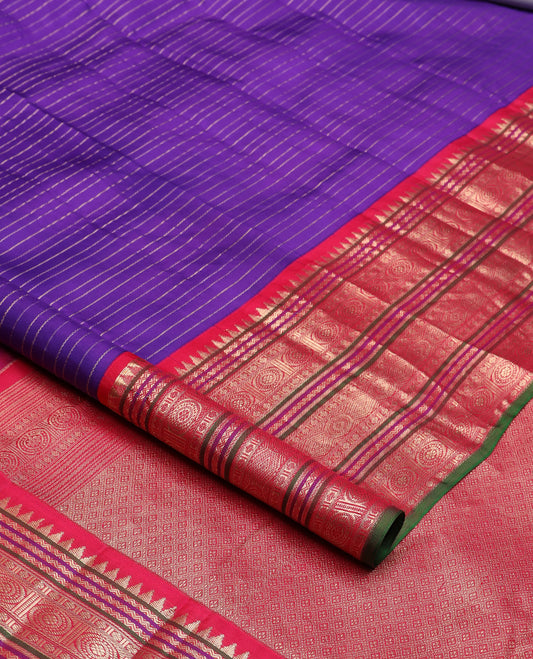 Blue zari stripes silk saree, contrast korvai border of rekku, neli, kamalam, and poo chakram designs, and jaal pallu